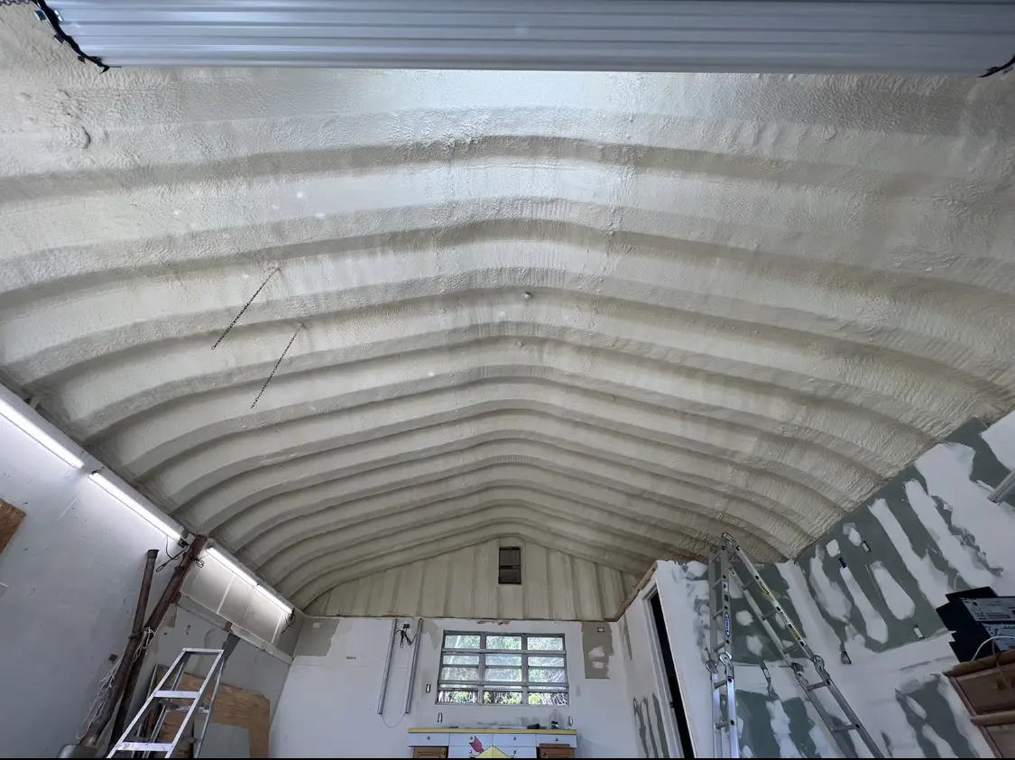 Spray polyurethane foam applied to the underside of a metal roof deck in Pine Castle